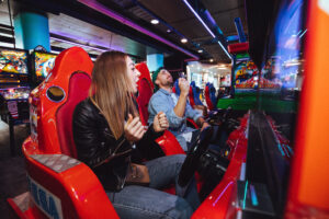 Couple playing arcade games