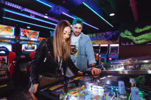 Couple Playing Pinball