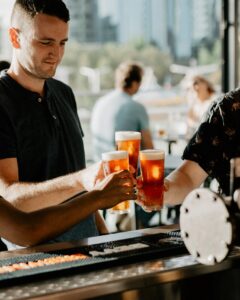 Men cheersing their beers