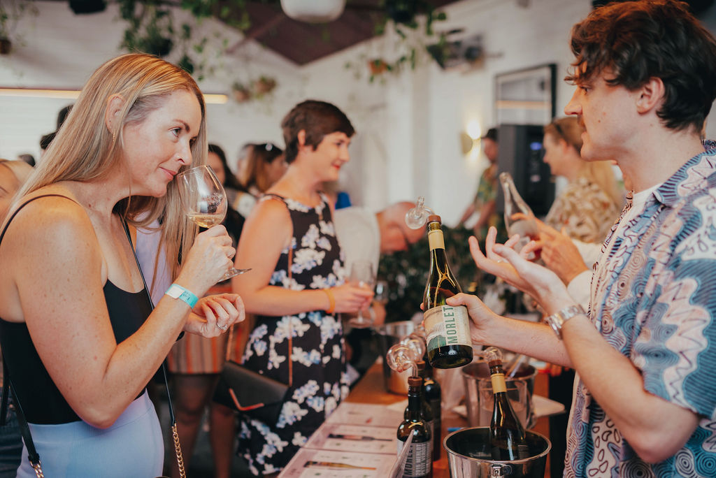 Women smelling a glass of wine